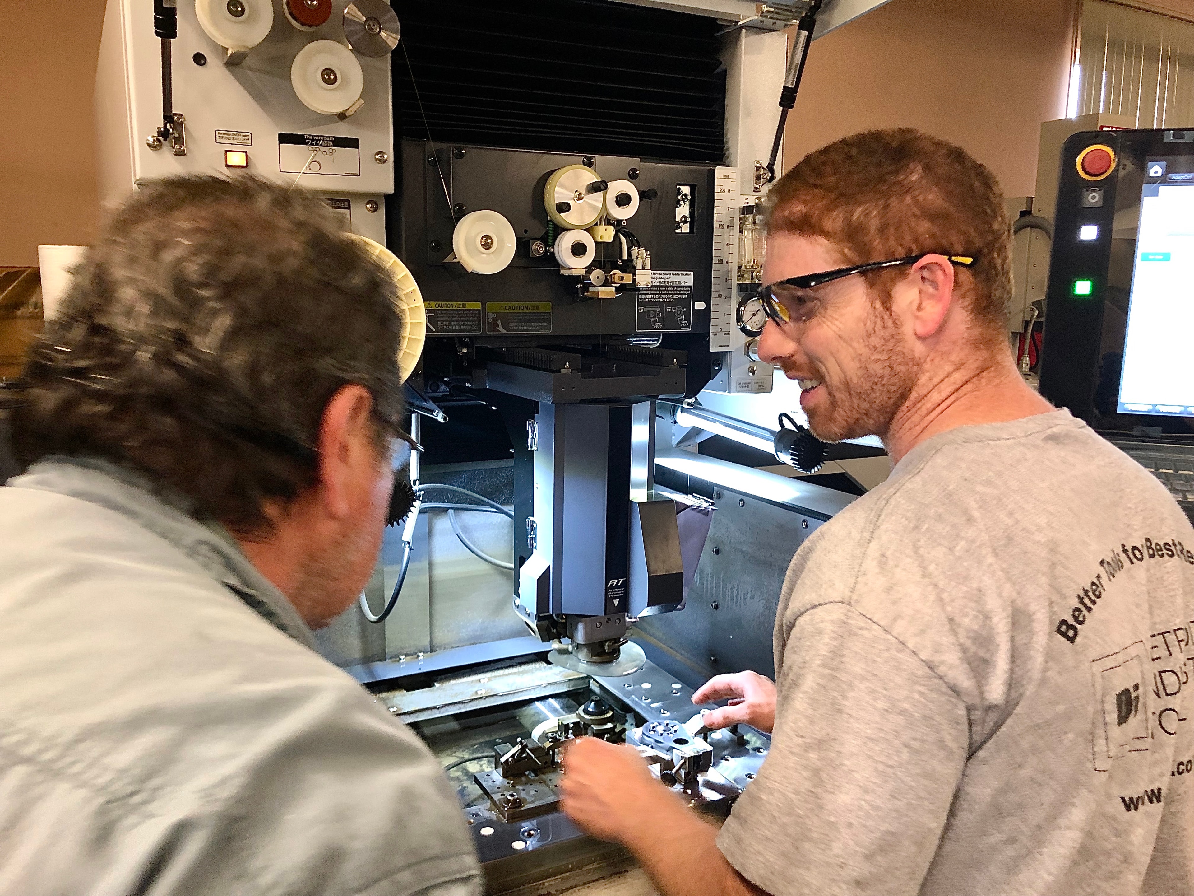 Machinists operating Wire EDM equipment